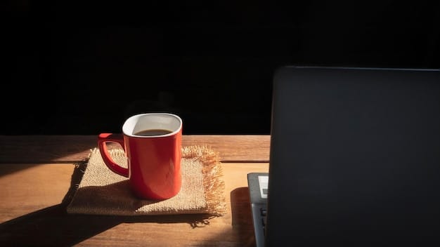 A calm and productive home office setup with a laptop, paperwork, and a cup of coffee. Natural light is streaming in.