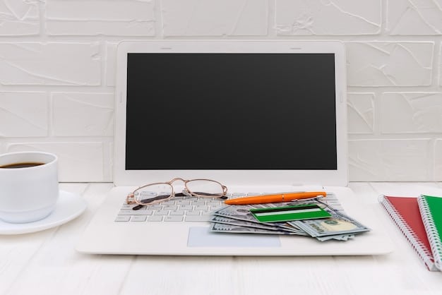 An organized desk with a laptop showing a financial spreadsheet, a business credit card, and a business bank statement, illustrating the separation of business and personal finances.