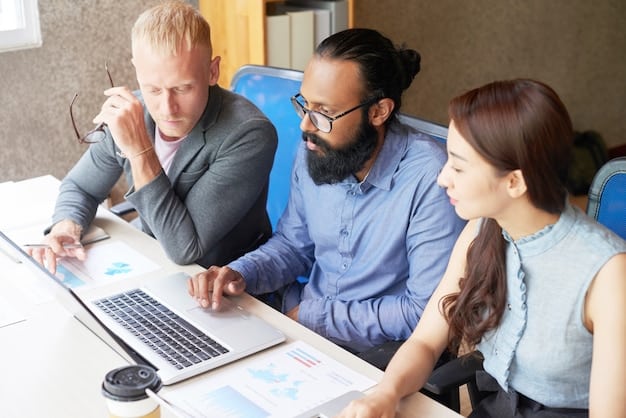 A corporate finance team brainstorming around a table with charts and laptops, displaying complex financial data and debt restructuring plans.